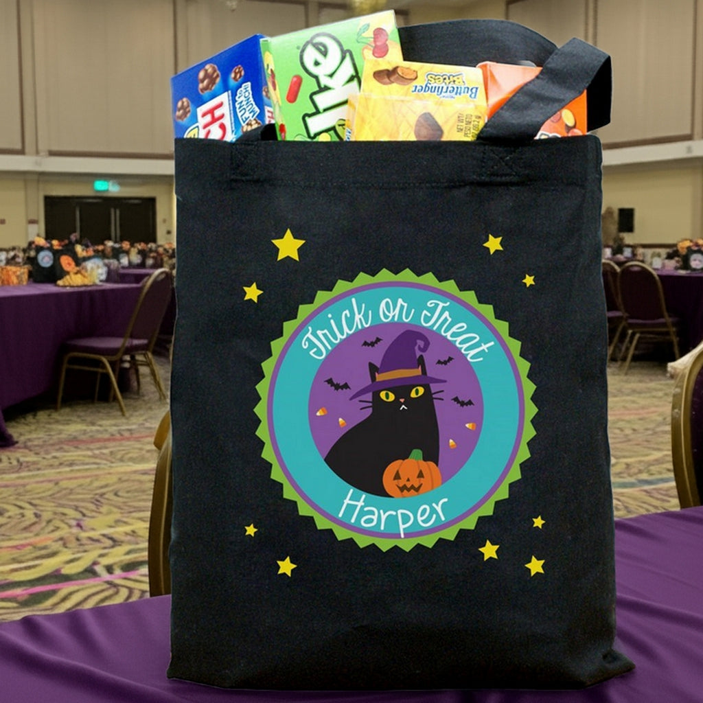 personalized trick or treat bag black tote with purple chevron cat face orange bow name Sophia filled with candy