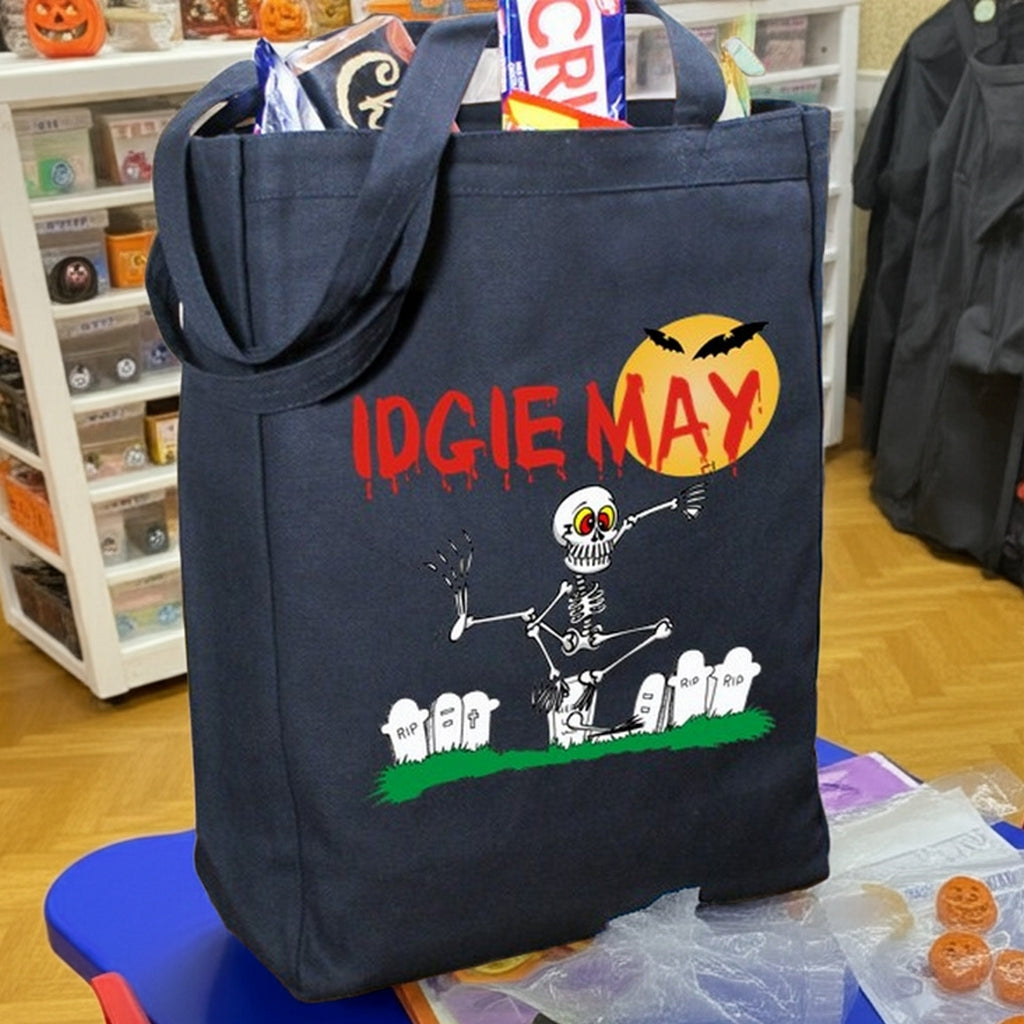 Navy Halloween tote with skeleton and gravestones full of candy and red IDGIE MAY print personalized trick or treat bag