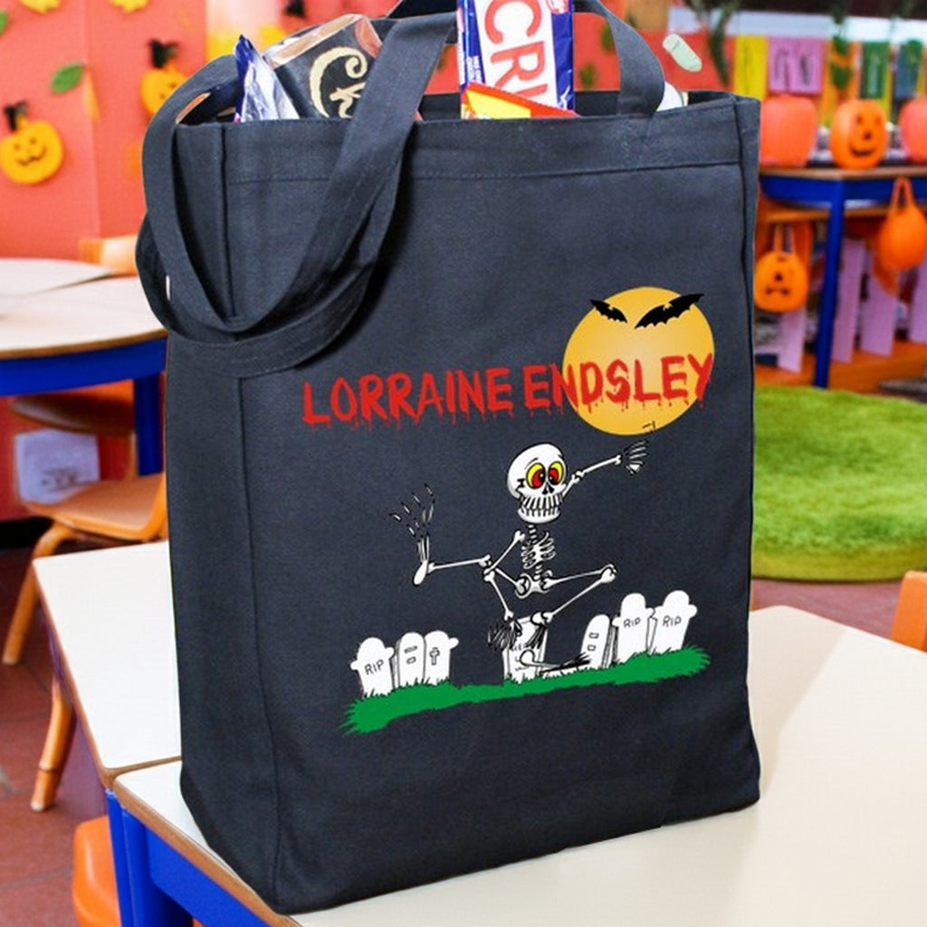 Black Halloween tote bag with skeleton graveyard moon and red name LORRAINE ENDSLEY personalized trick or treat bag