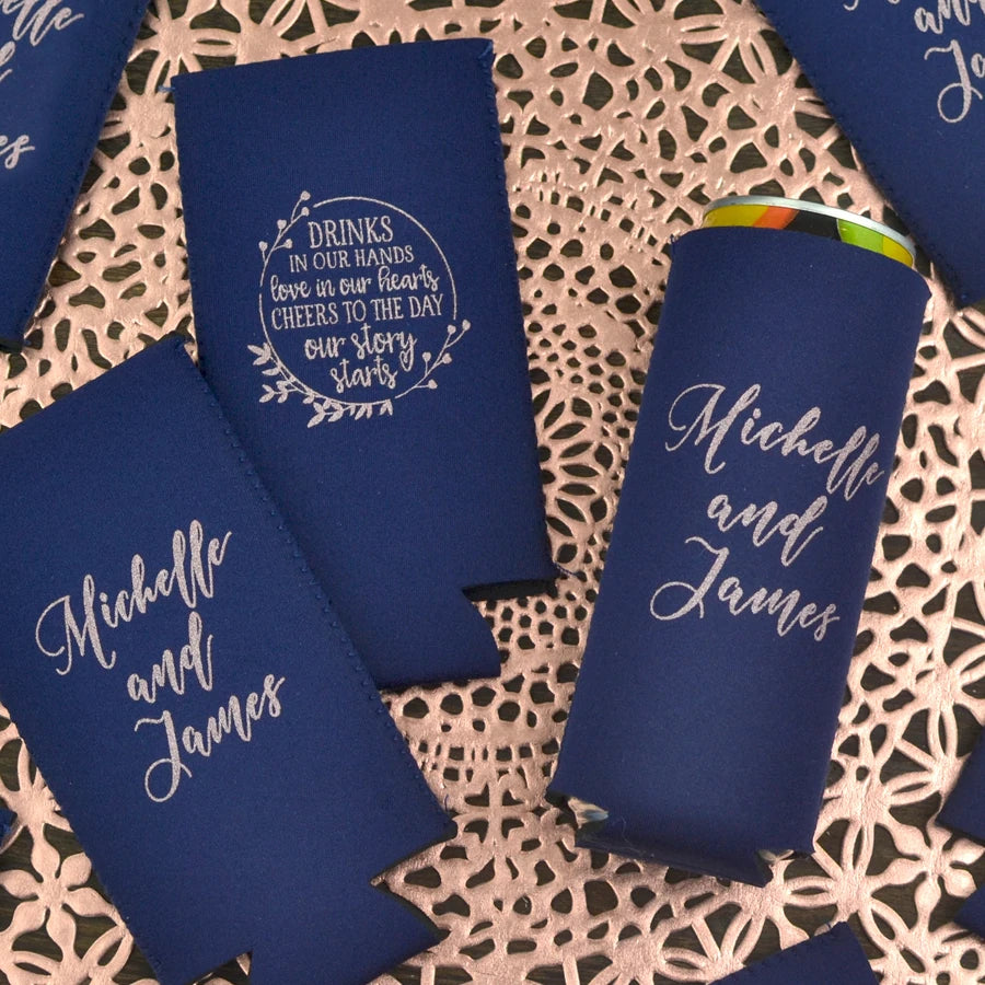 Navy color slim wedding can coolers personalized with drinks in our hands design on back side and bride and groom name on back side in silver print
