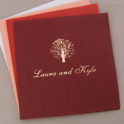Fall color linen look wedding beverage napkins personalized with tree design and bride and groom name in metallic copper print