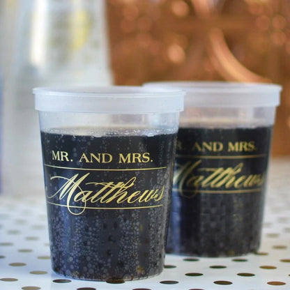 Clear 16 oz. wedding stadium cups personalized with Mr and Mrs monogram design in gold imprint color