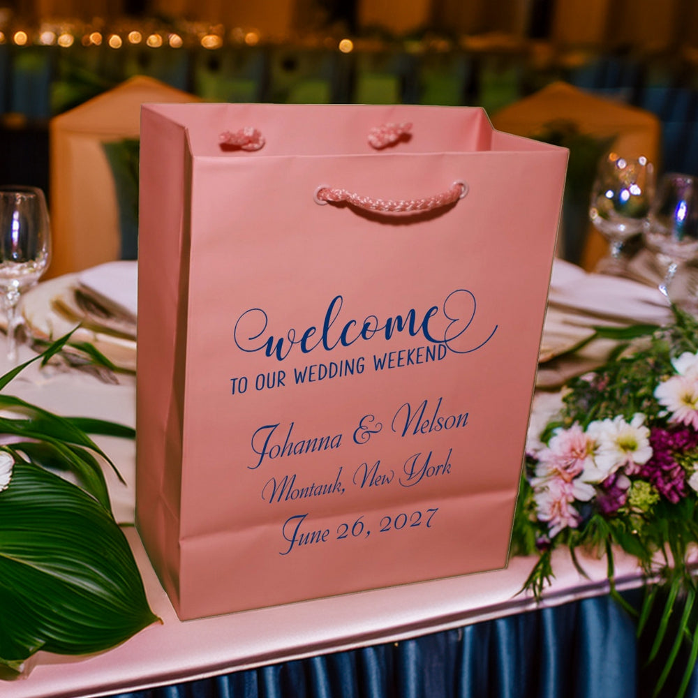 Tippytoad pink wedding gift bag on table with floral decor wedding welcome bags custom printed for guests