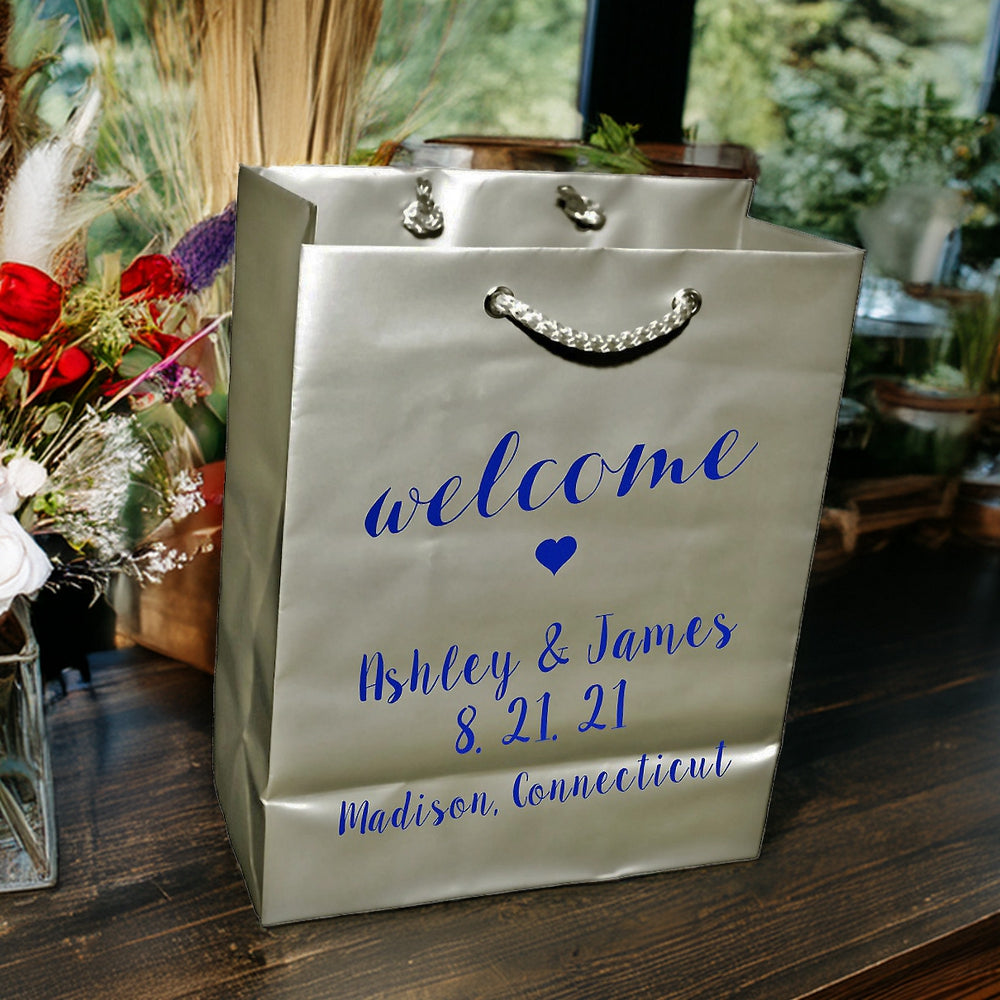 Tippytoad metallic silver wedding welcome bags custom printed with blue script names date and rope handles
