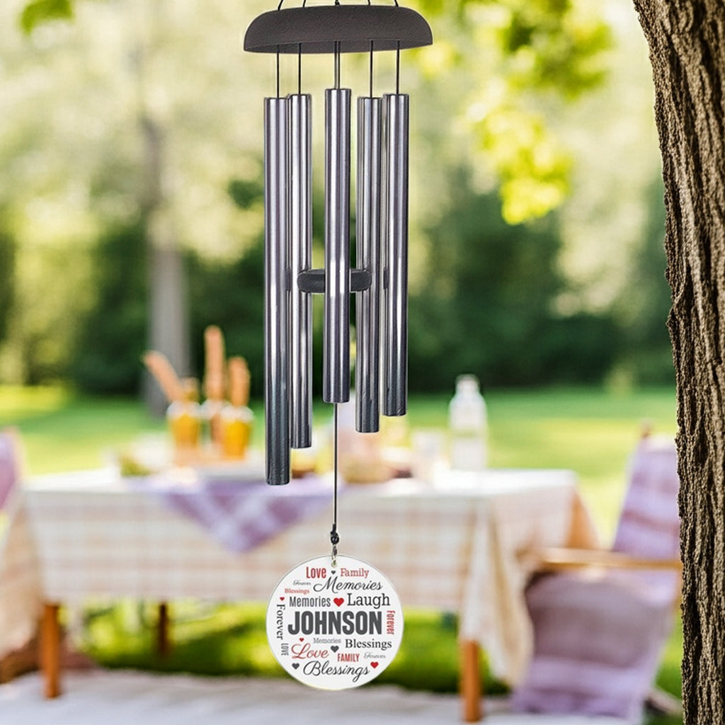 Personalized wind chime with metal tubes and custom wind sail hanging outdoors