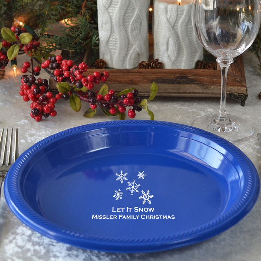 Blue plastic Christmas dinner plates with 'Let It Snow' design for festive family gatherings