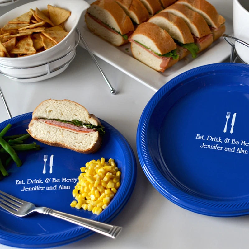 Blue plastic wedding dinner plates custom printed with fork and knife desing and custom message from the bride and groom in white ink.