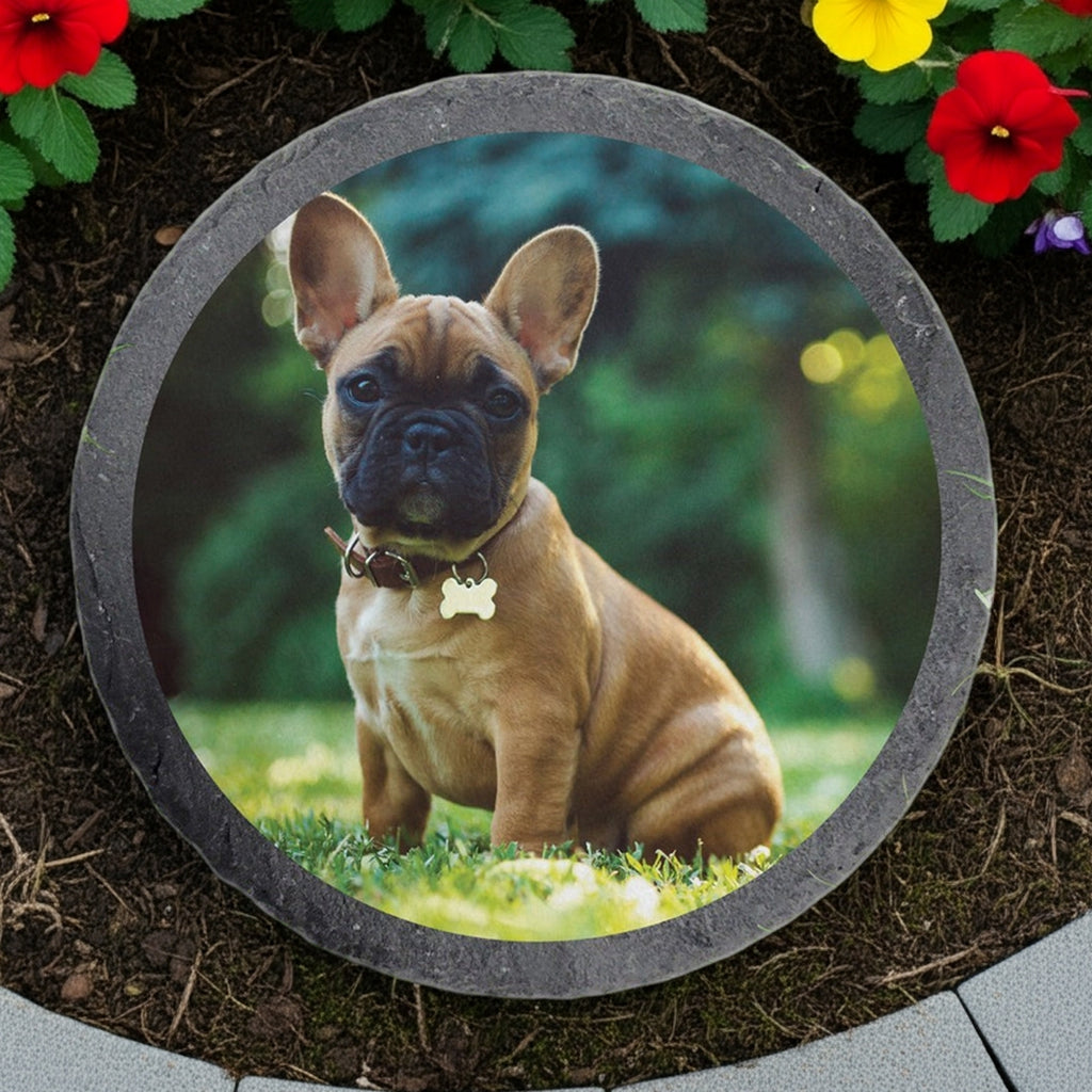 Round slate custom photo garden stone featuring a dog portrait surrounded by flowers