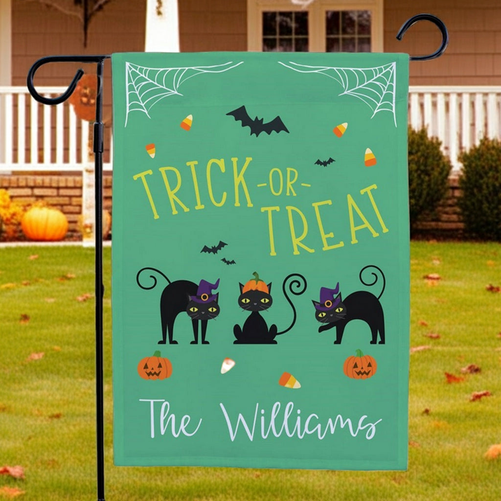 Halloween garden flag with Trick or Treat text, three black cats, candy corn and pumpkins, personalized The Williams
