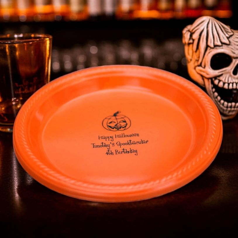 Orange personalized plastic Halloween appetizer and dessert plates with black jack o lantern and custom name print
