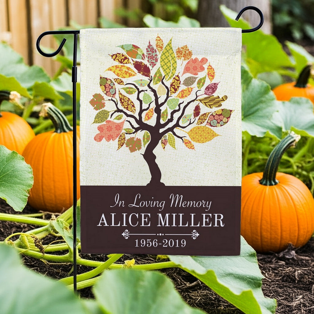 Tapestry Tree In Loving Memory personalized garden flag with colorful tree and custom name displayed in a garden setting