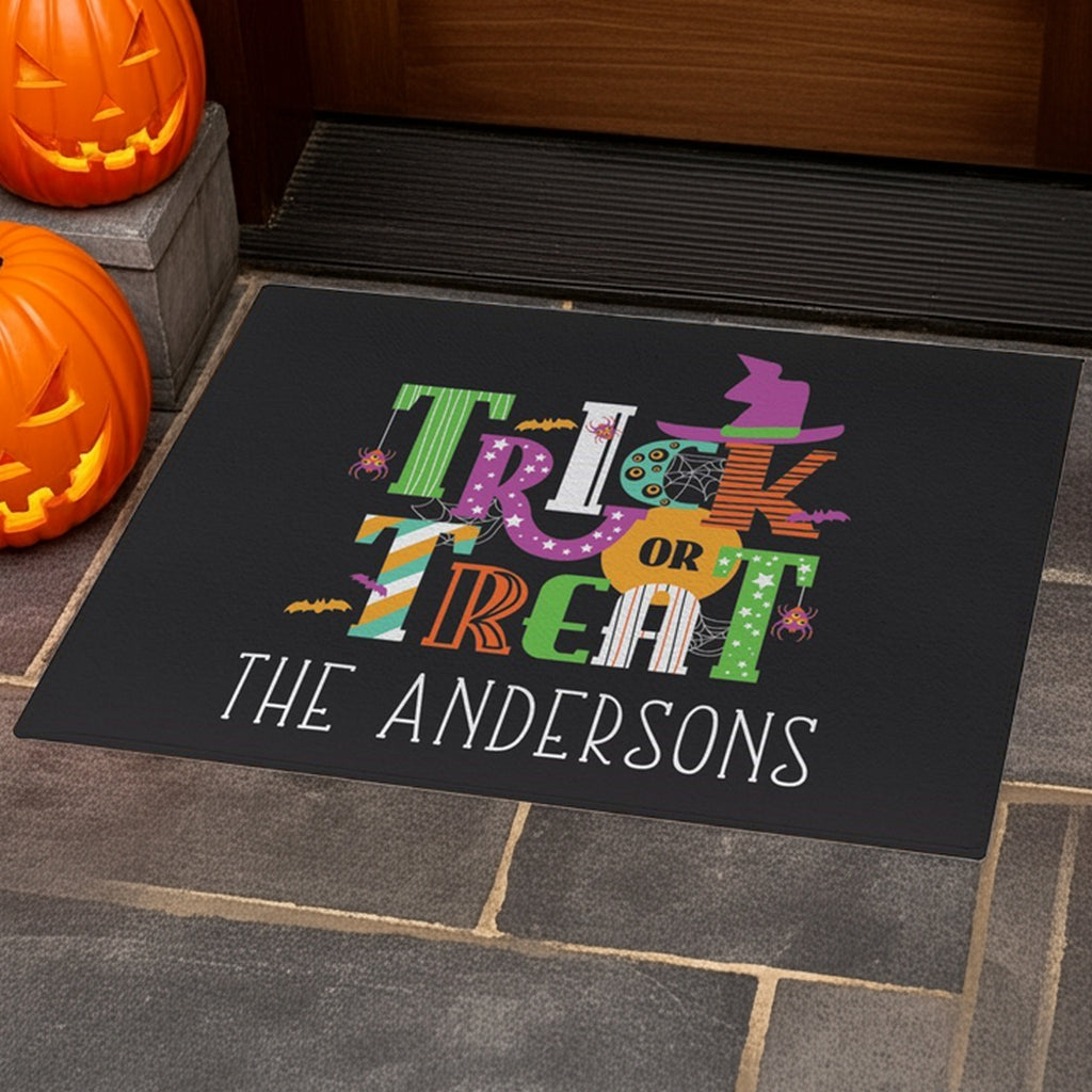 Trick or treat personalized doormat with colorful Halloween design and custom family name