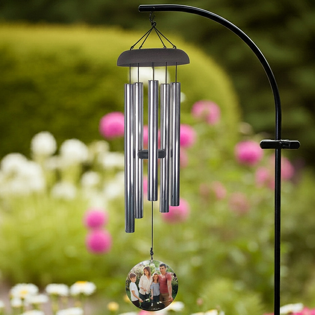 Wind chime personalized with photo wind sail hanging from tree branch outdoors