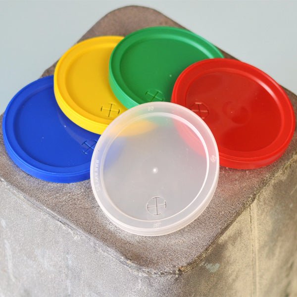Snap on lids for plastic 12 oz. stadium cups available in clear, blue, yellow, green, and red lid color options
