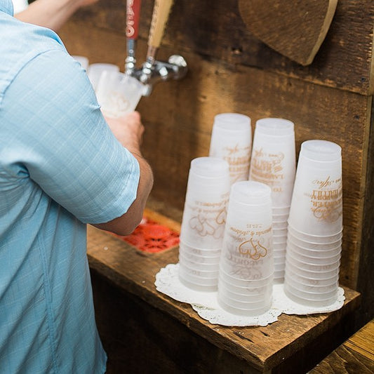 Custom printed wedding cups stacked at wedding reception beer truck