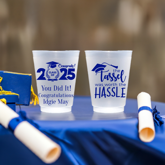 Frosted plastic cups personalized with Class of 2025 clipart and custom text on front side and Tassel Hassle clipart on back side in royal blue print