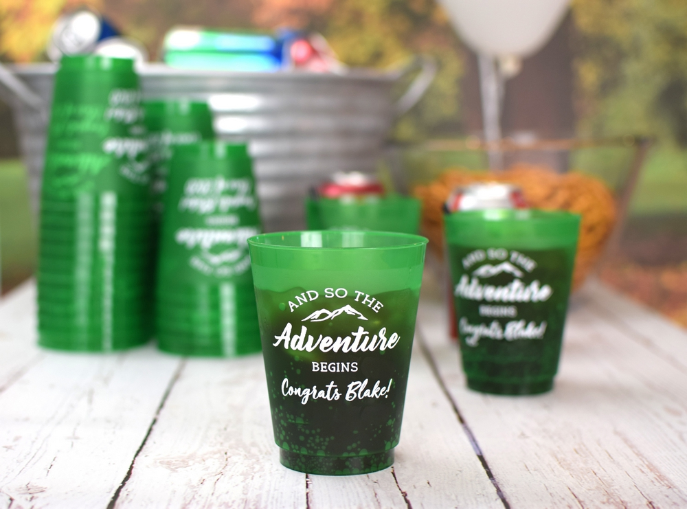 Green reusable stadium style cups with white custom script for grad parties featuring names and year graduation cups personalized