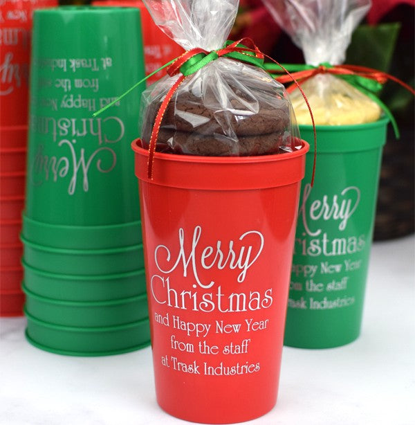 Red and Green 32 oz. stadium cups personalized with 'Merry Christmas' design and three lines of text in silver imprint color filled with Christmas cookies