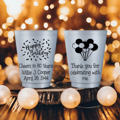 Silver frost reusable plastic cups personalized for eightieth birthday with 'Happy Birthday' design and 'Cheers to 80 Years' custom text on front and 'Balloons' design and custom text on back in black print