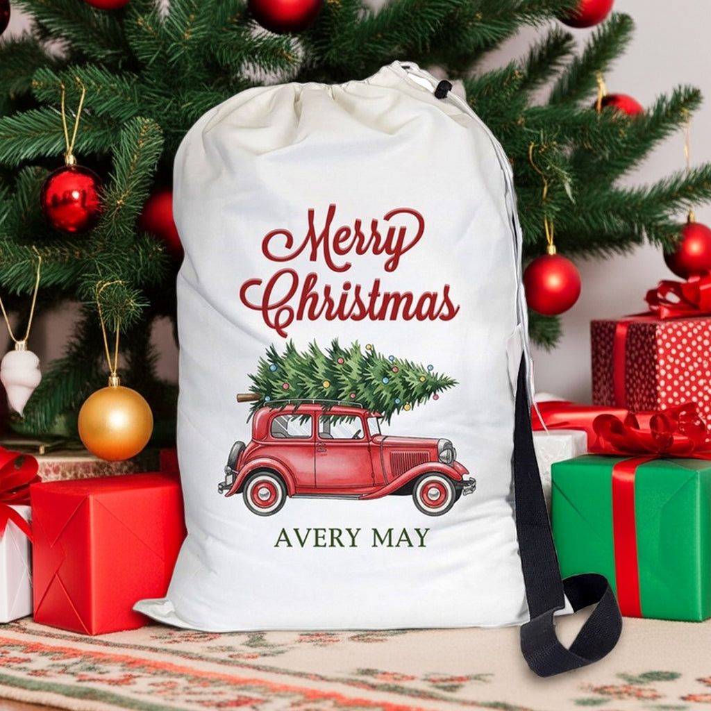 Santa gift sack featuring a vintage red truck with a Christmas tree and festive lettering