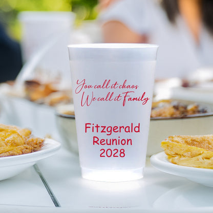 Clear personalized family reunion cups with red text Fitzgerald Reunion 2028 on picnic table