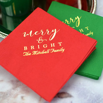 Paper Christmas cocktail napkins personalized with merry and bright design and custom text in gold print