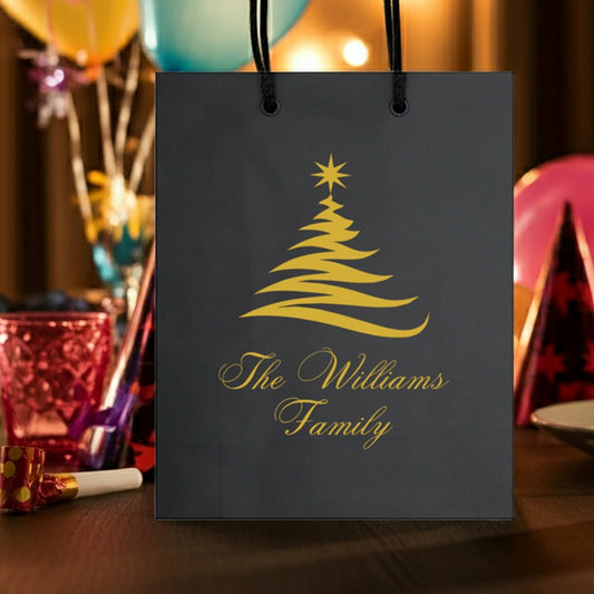 Elegant black Christmas gift bags with a gold tree design, perfect for holiday celebrations
