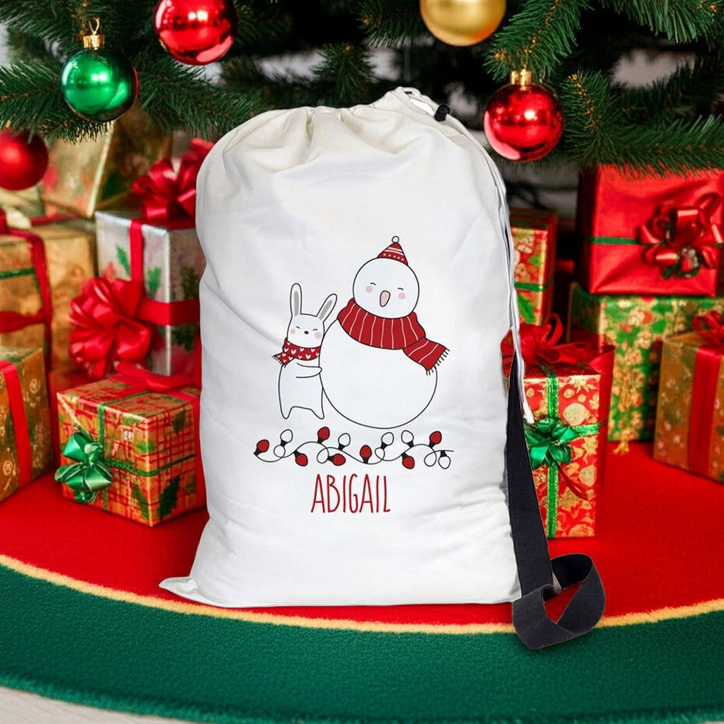 Personalized Christmas gift sack featuring a snowy scene with a snowman and a bunny, ideal for holiday gifting