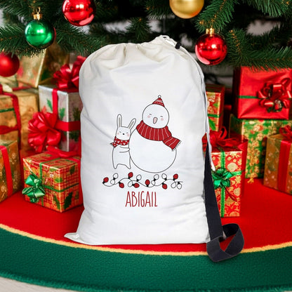 Personalized Christmas gift sack featuring a snowy scene with a snowman and a bunny, ideal for holiday gifting