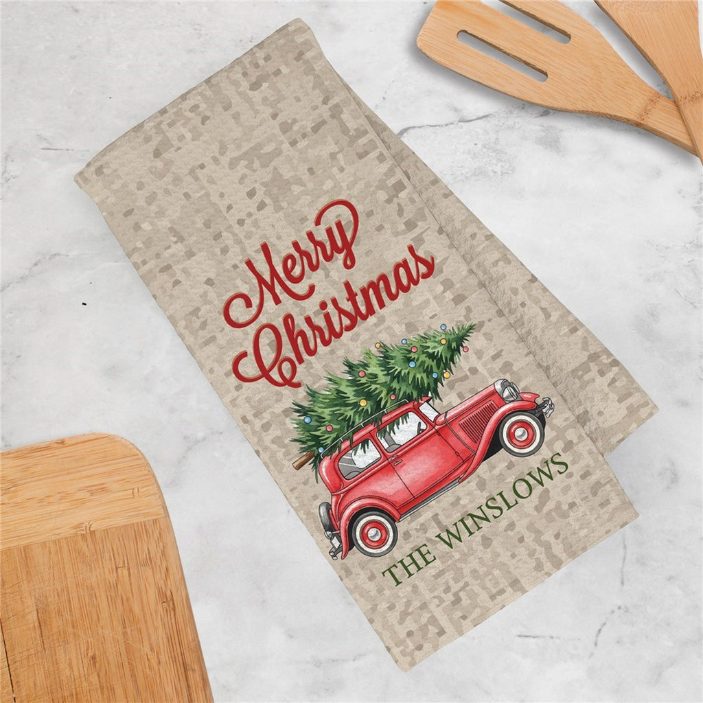 Festive Christmas kitchen towel featuring a vintage red car with a Christmas tree and Merry Christmas design