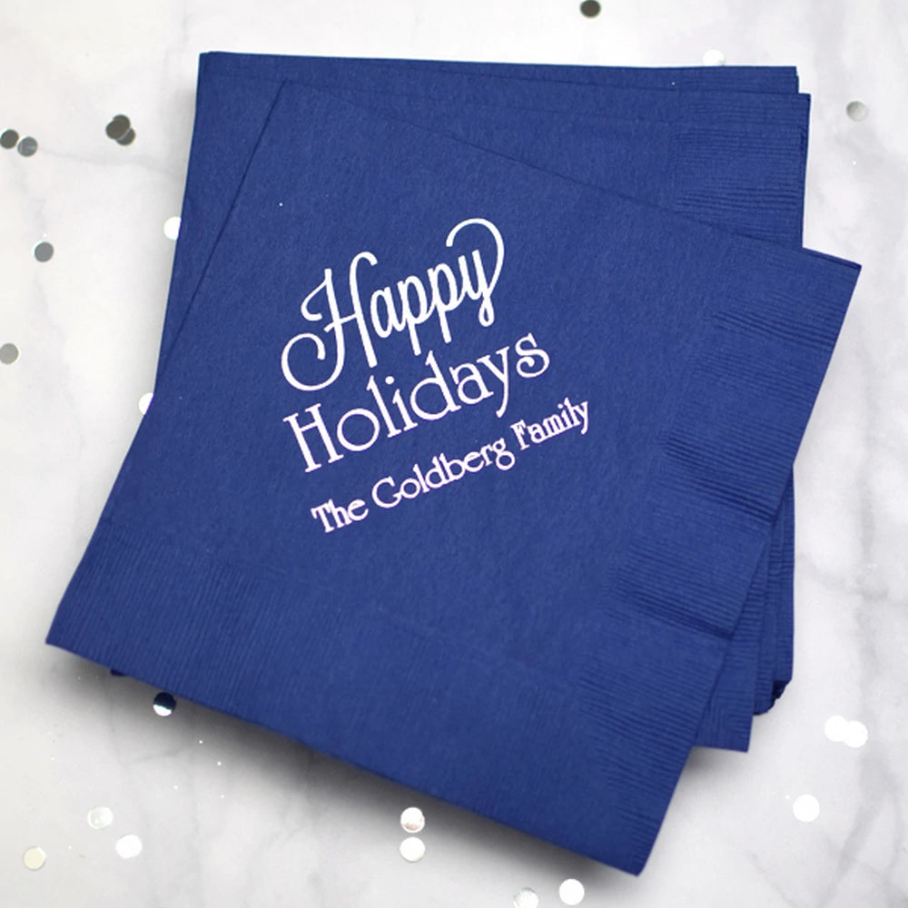 Blue Christmas paper luncheon napkins personalized with Happy Holidays design and family name in white print