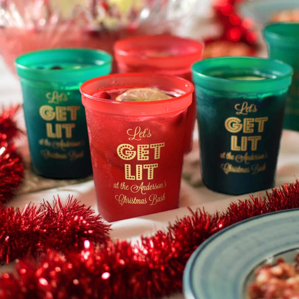 Colorful Tippytoad Christmas party stadium cups with festive 'Get Lit' design for holiday celebrations