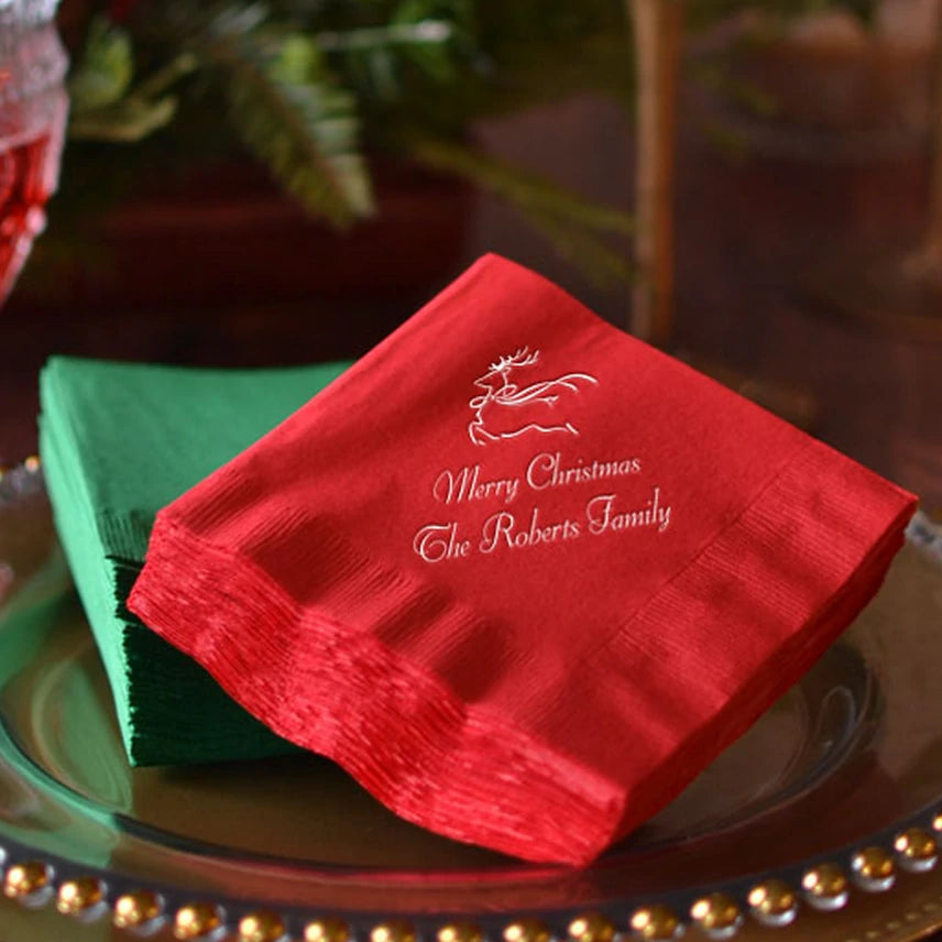 Christmas cocktail napkins personalized with contemporary deer design and cusotm text in white print