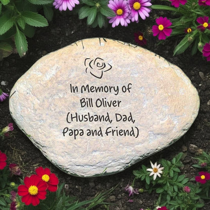 Custom engraved memorial garden stone with 4 lines of In Memory of text surrounded by flowers