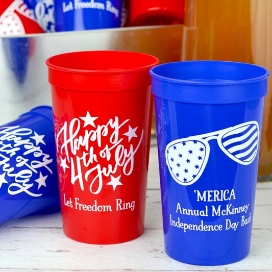 Red and blue color stadium cups personalized for summer party with happy 4th of july design, star spangled sunglasses design and custom text in white print