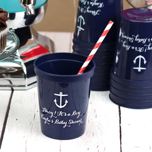Navy 16 oz. stadium baby shower cups personalized with anchor design and two lines of custom text in white print