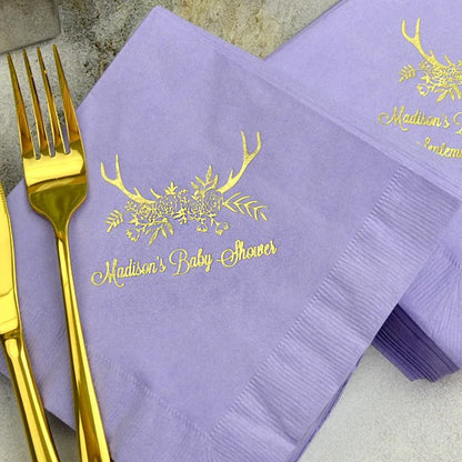 Purple baby shower luncheon napkins personalized with floral antlers design and custom text in gold print