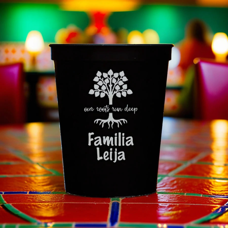 Black color 16 oz family reunion cup personalized with our roots run deep designa and 2 lines of text in silver print