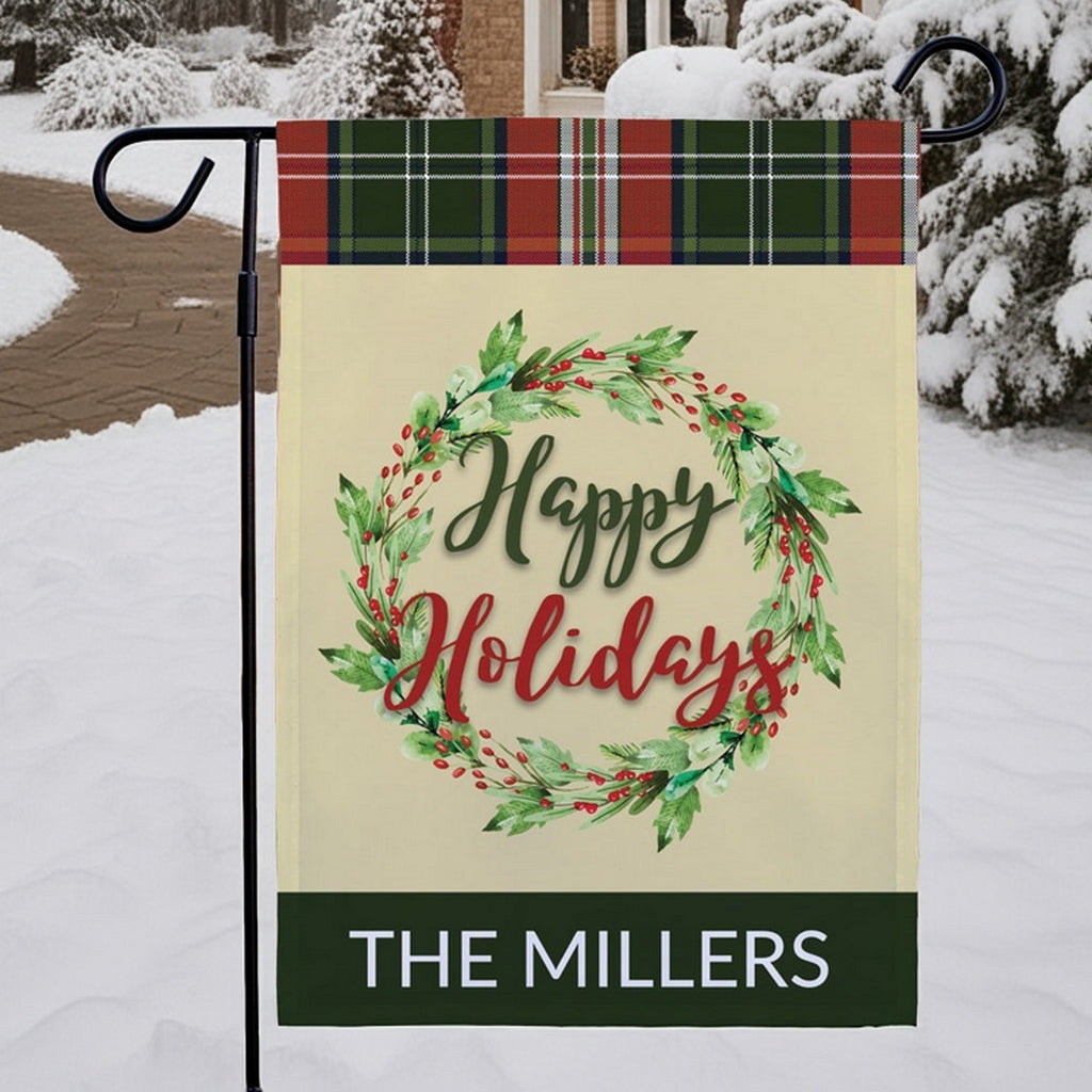 Personalized garden flag featuring a Happy Holidays design with a wreath and customizable name for festive outdoor decor