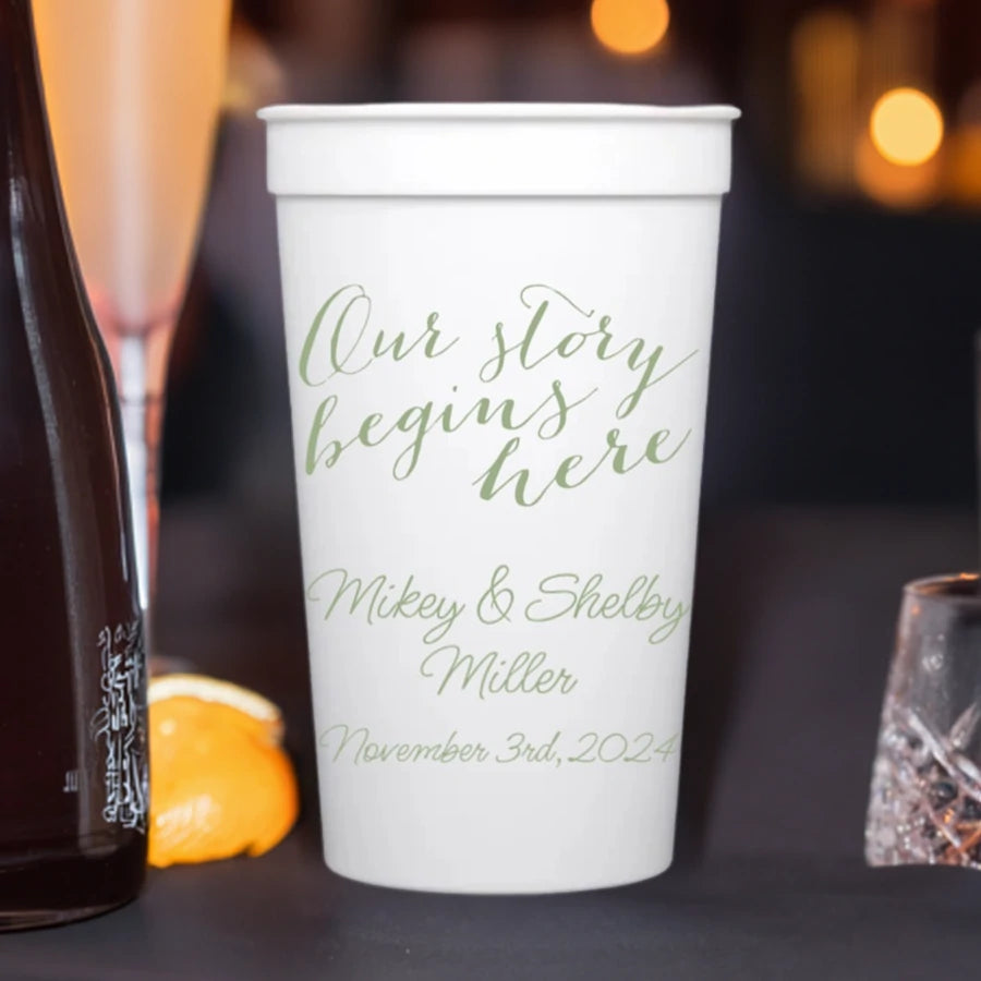 White color 22 oz wedding stadium cup personalized with our story begins here and 3 lines of custom text in sage print