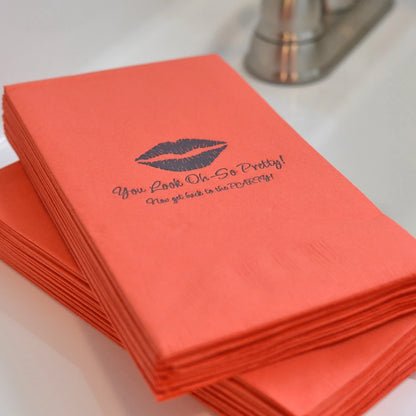 Coral color 3-ply paper wedding guest towels personalized with 'Lips' design and 2 lines of custom text in black imprint color