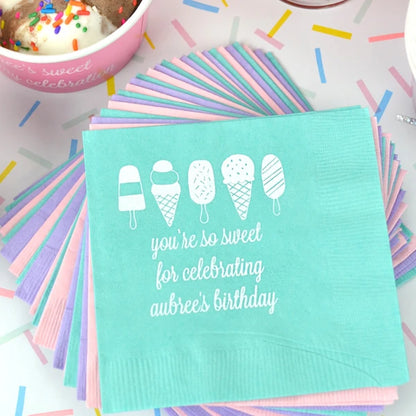 Mint color cocktail napkins personalized for summer birthday party with ice cream cones design and 3 lines of text in white print