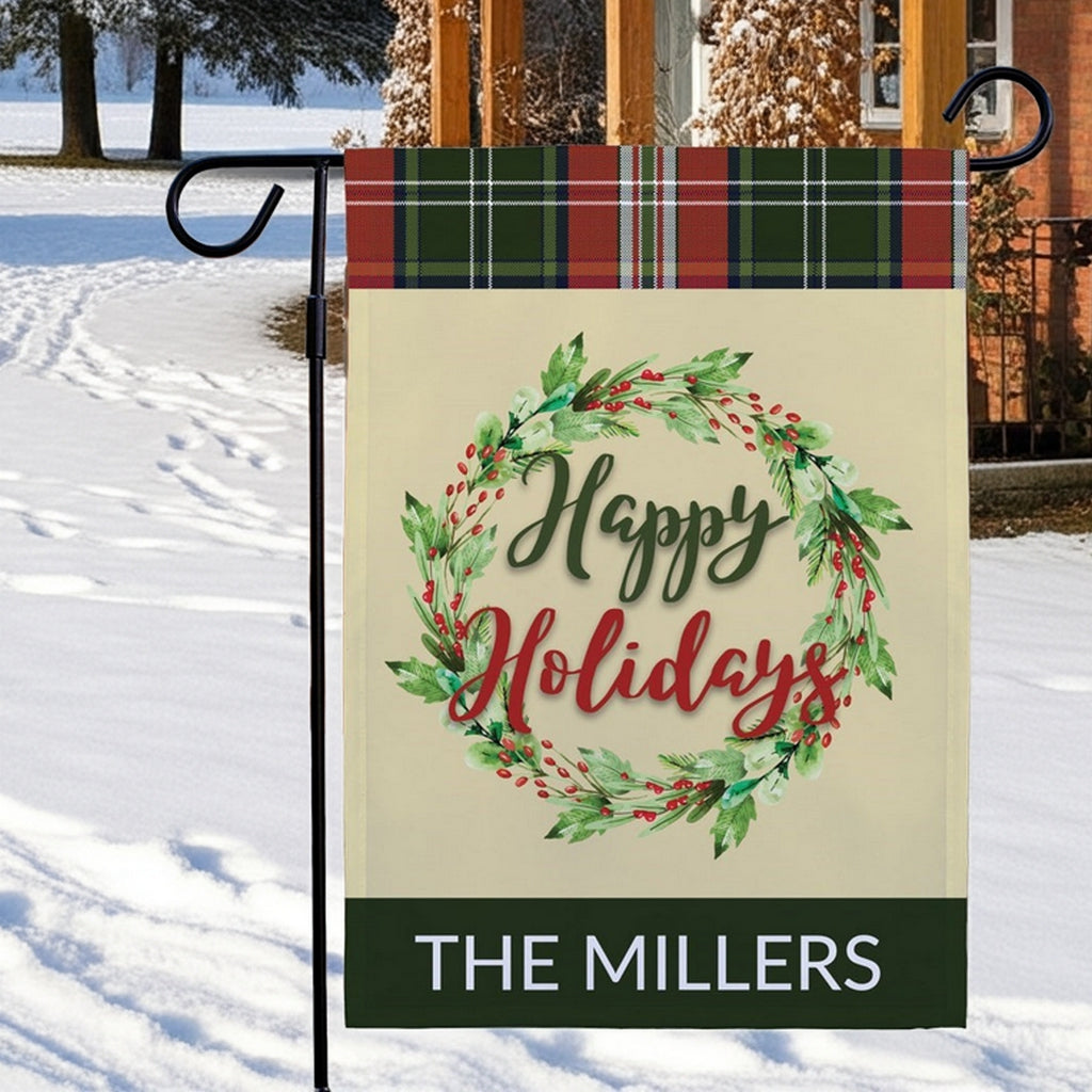 Personalized garden flag with a holiday wreath design and the text Happy Holidays The Millers