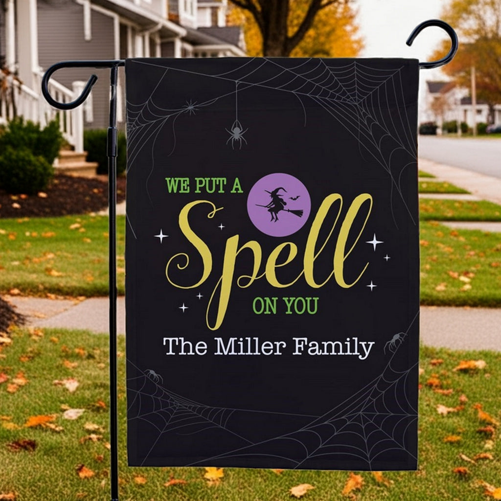 Customized Halloween garden flag black with witch silhouette purple moon spider webs and The Miller Family name for yard decor