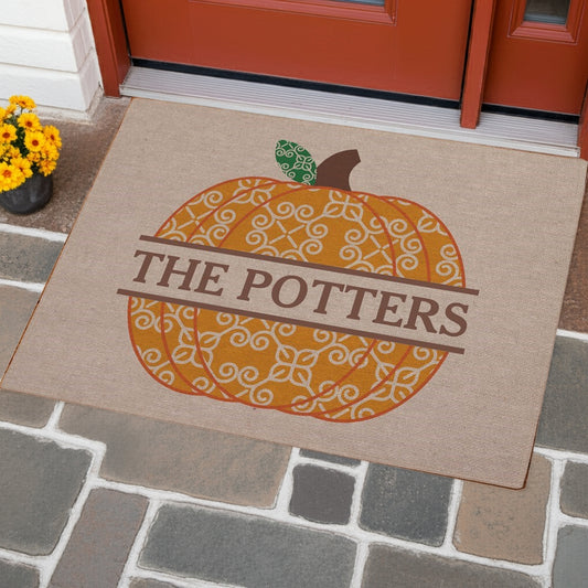 Decorative fall pumpkin personalized doormat with name The Potters in orange and brown