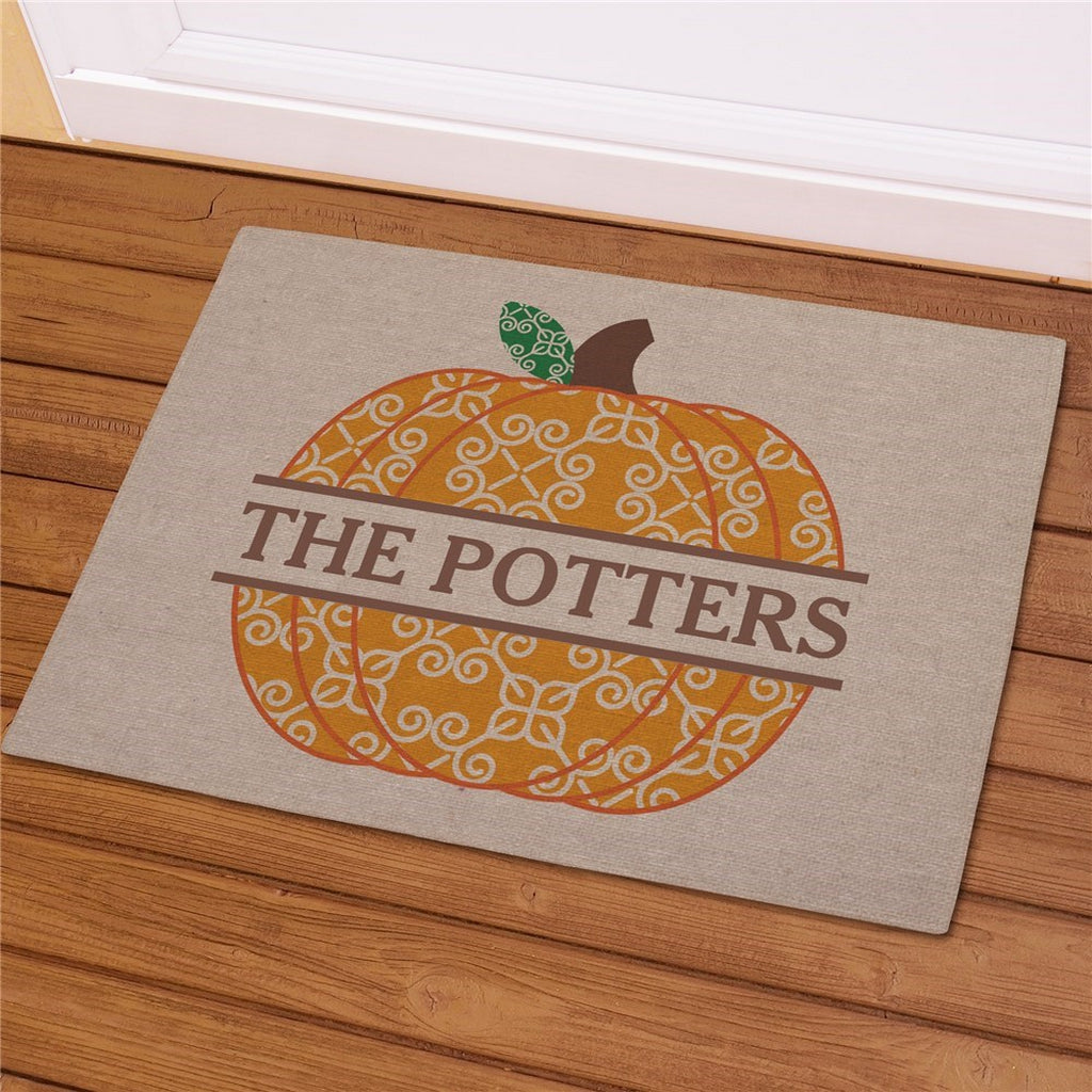 Decorative fall pumpkin personalized doormat with orange patterned pumpkin and custom family name on beige background
