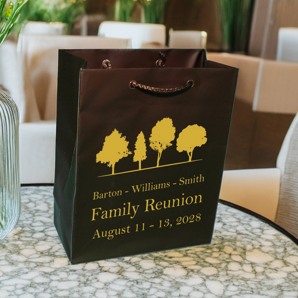 Personalized family reunion welcome gift bags in black with yellow tree design and family names