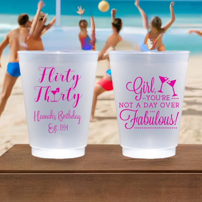 Flirty Thirty 30th birthday custom printed in hot pink print on clear frosted cups. 'Girl, You're Not A Day Over Fabulous!' design printed on back side. Fun thirtieth birthday party souvenir cups.