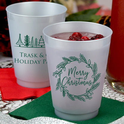 Frosted plastic Christmas party cups with festive designs for holiday celebrations