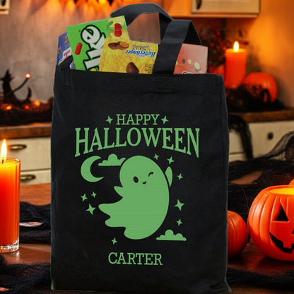 glow in the dark ghost personalized trick or treat bag showing green ghost Happy Halloween design with name Carter